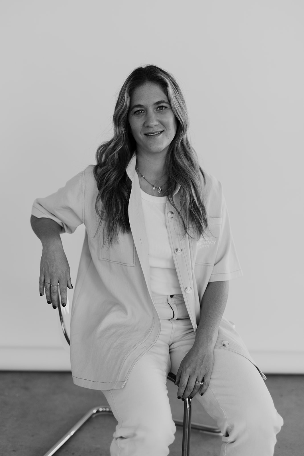 Jane Ippolito, registered midwife, nurse and IBCLC, seated in a bright studio